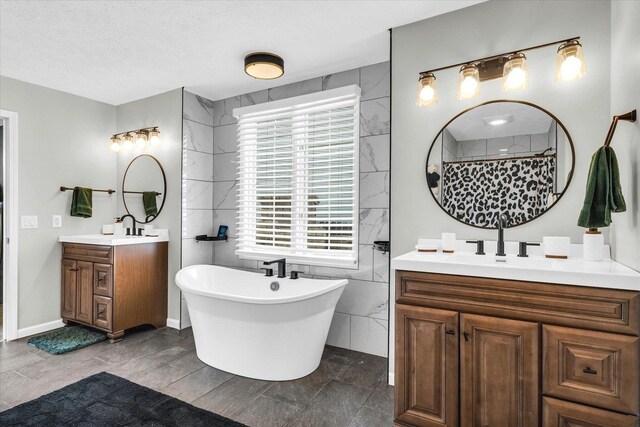 2501 Woodridge Pl, Champaign, IL 61822 - bathroom with two vanities, a soaking tub, a textured ceiling, and a shower with shower curtain