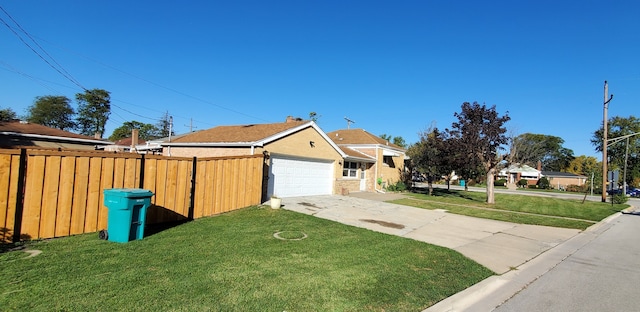 exterior space featuring a front lawn and a garage