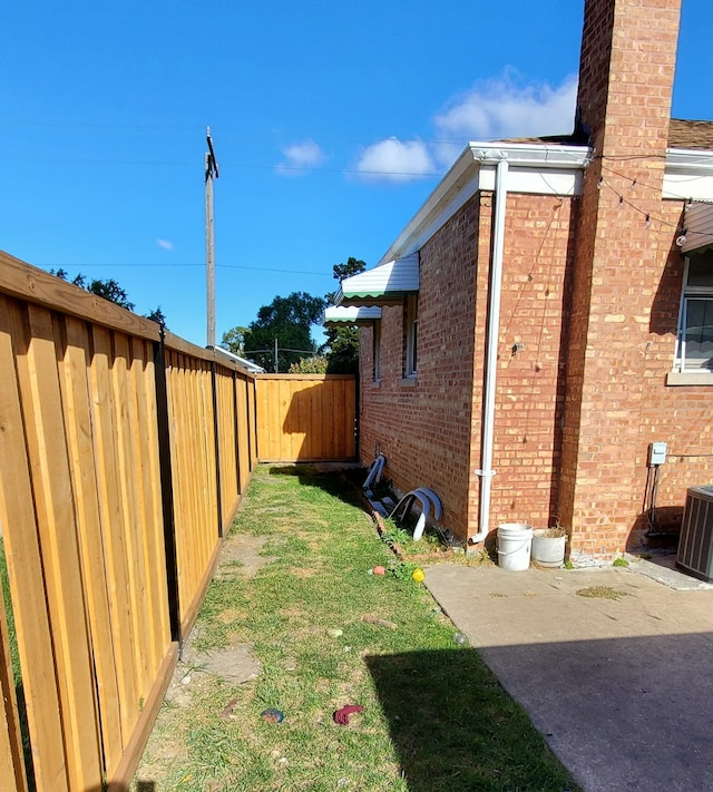 view of yard with central AC