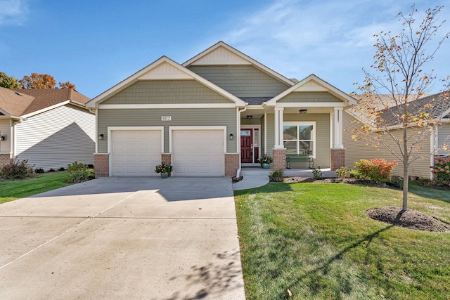 craftsman inspired home featuring a garage and a front yard