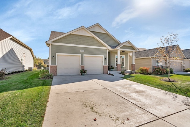 craftsman-style house featuring a front yard and a garage