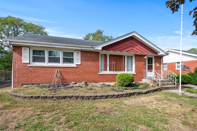 single story home with a front yard