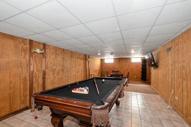 rec room with billiards, wooden walls, a drop ceiling, and light tile patterned flooring