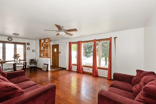 living room with ceiling fan and hardwood / wood-style flooring