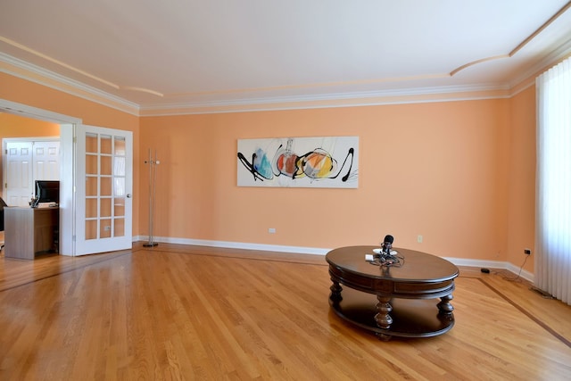 interior space with ornamental molding, french doors, and wood-type flooring