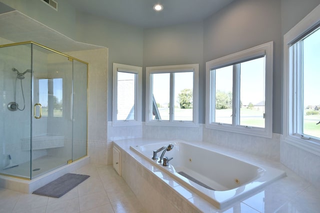 bathroom with tile patterned flooring and plus walk in shower