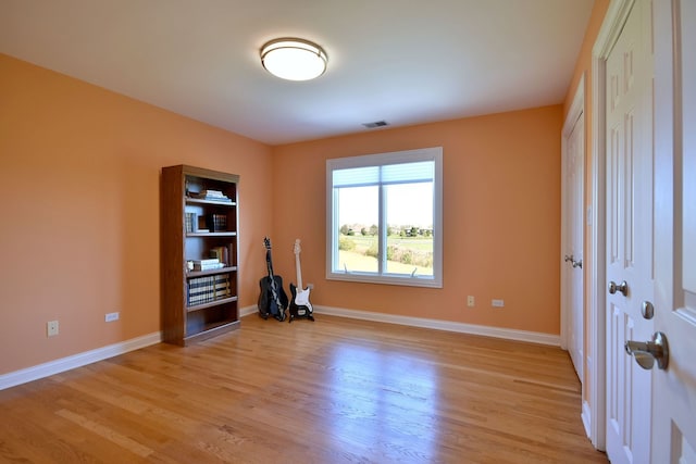 unfurnished room featuring light wood-type flooring