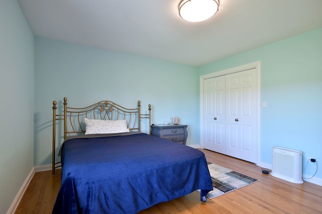 bedroom featuring a closet and hardwood / wood-style floors