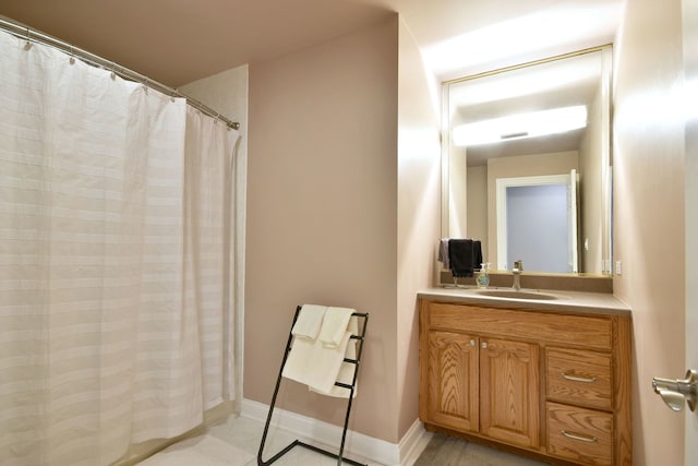 bathroom featuring vanity and a shower with curtain