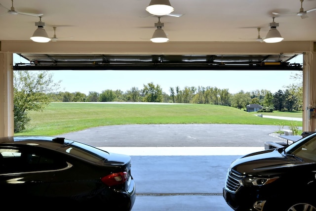 exterior space featuring a lawn and ceiling fan