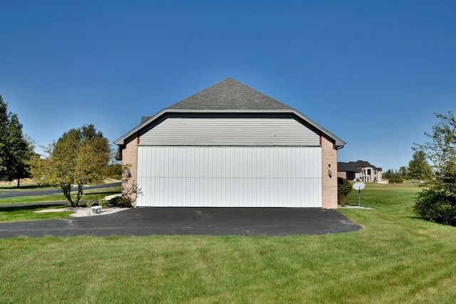 garage with a yard