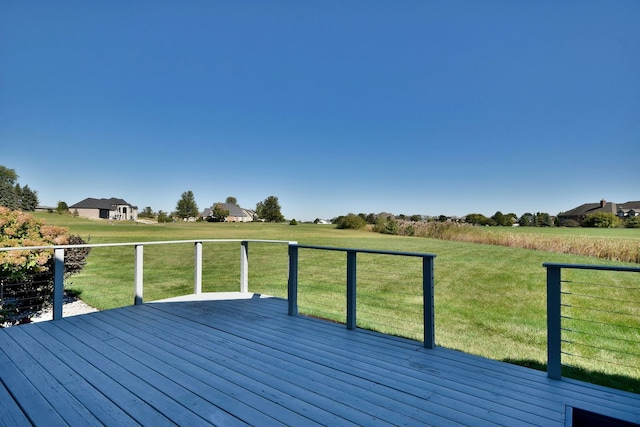 wooden terrace featuring a lawn