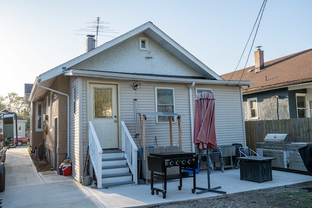 back of house featuring a patio area