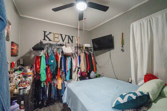 bedroom featuring ceiling fan and crown molding