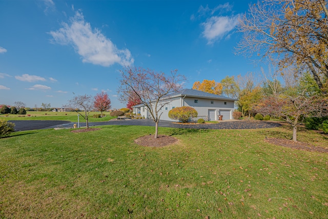 view of yard featuring a garage