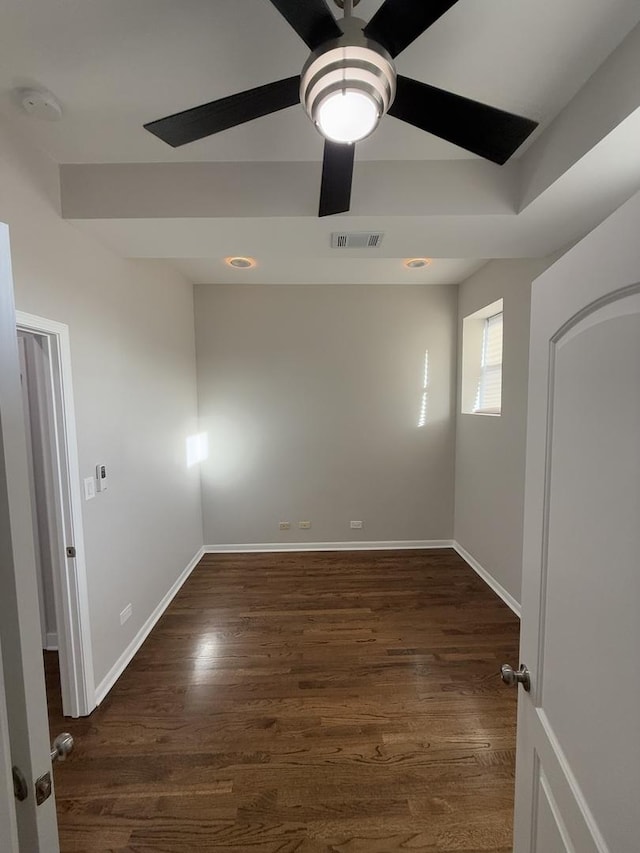 unfurnished room featuring dark hardwood / wood-style flooring and ceiling fan