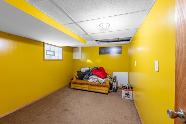 carpeted bedroom featuring a paneled ceiling