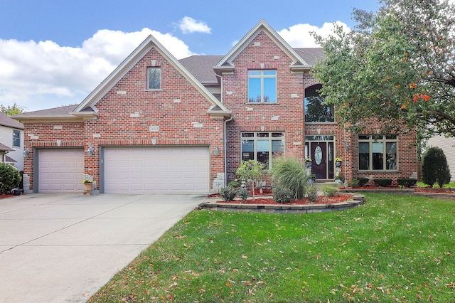 view of property with a front lawn and a garage