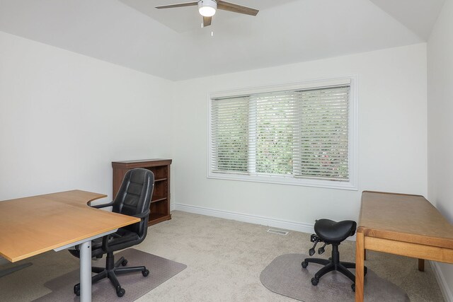 office featuring light carpet, ceiling fan, and lofted ceiling