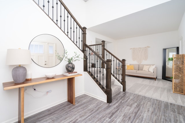 stairway with wood-type flooring