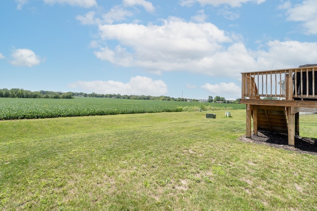 view of yard featuring a deck and a rural view