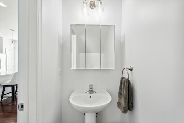 bathroom featuring sink and hardwood / wood-style floors