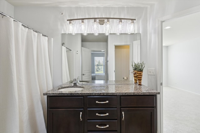 bathroom with vanity and walk in shower