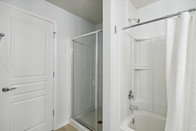 bathroom featuring shower / tub combo with curtain