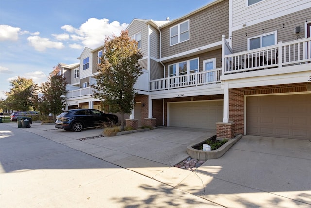 view of front of house featuring a balcony and a garage