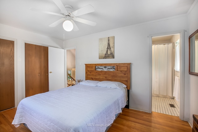 bedroom with crown molding, ceiling fan, and hardwood / wood-style floors