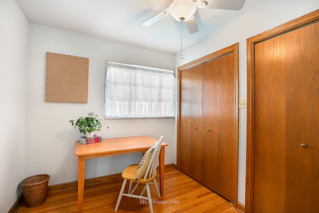 office with ceiling fan, light hardwood / wood-style flooring, and built in desk