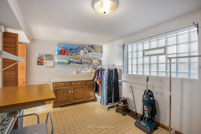 laundry area with ornamental molding