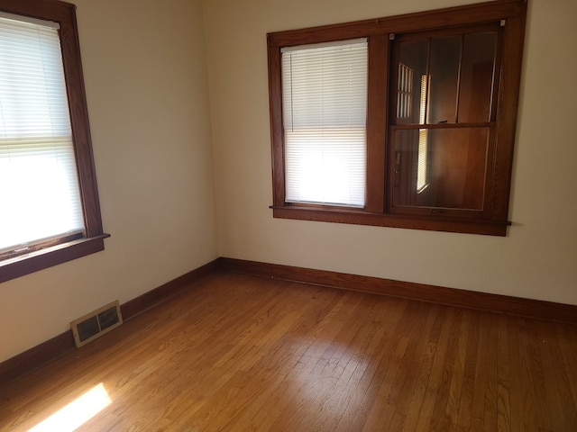 unfurnished room featuring light hardwood / wood-style flooring