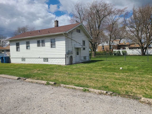 view of property exterior featuring a yard