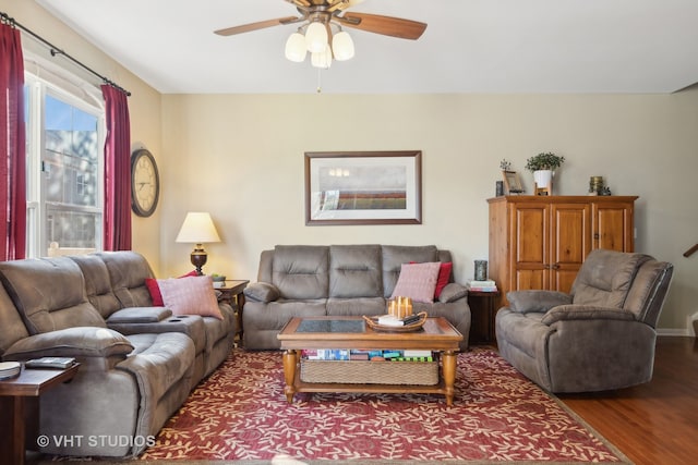 living room featuring hardwood / wood-style floors and ceiling fan