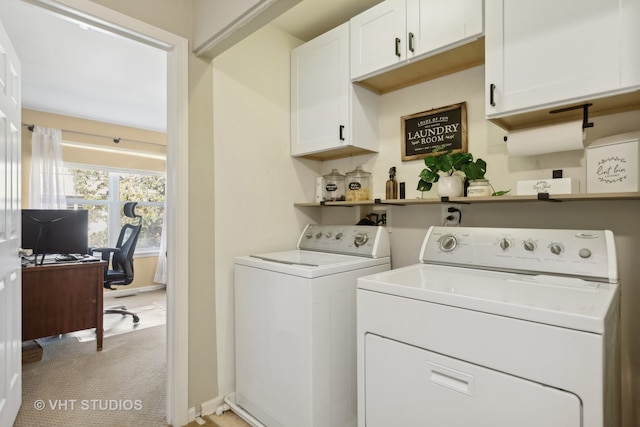 clothes washing area with light carpet, cabinets, and separate washer and dryer