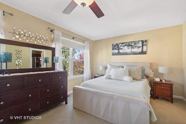 bedroom featuring light carpet and ceiling fan