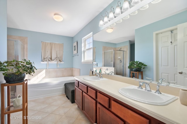 bathroom featuring vanity, shower with separate bathtub, and tile patterned flooring