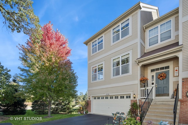 townhome / multi-family property featuring a garage