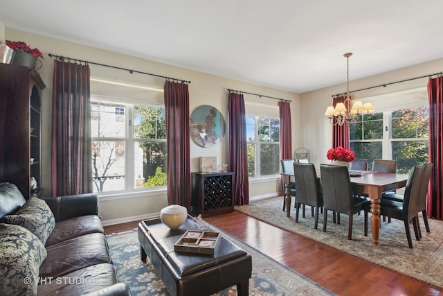 living room featuring hardwood / wood-style flooring, a chandelier, and plenty of natural light