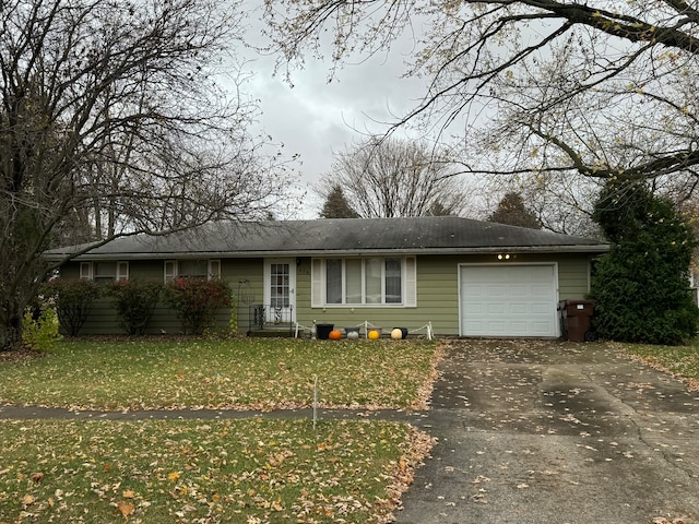 view of front of home with a garage and a front yard