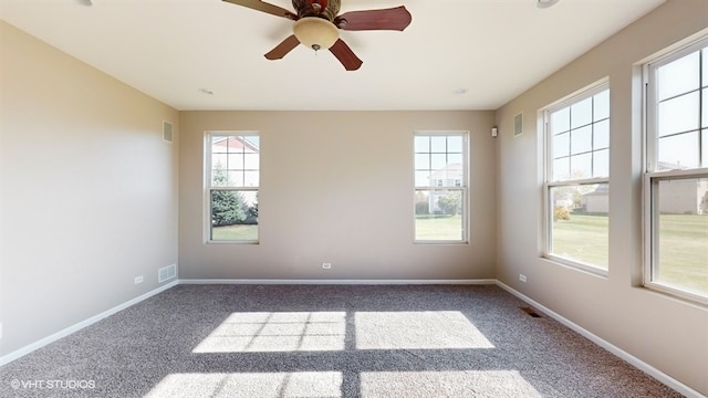 carpeted empty room with ceiling fan