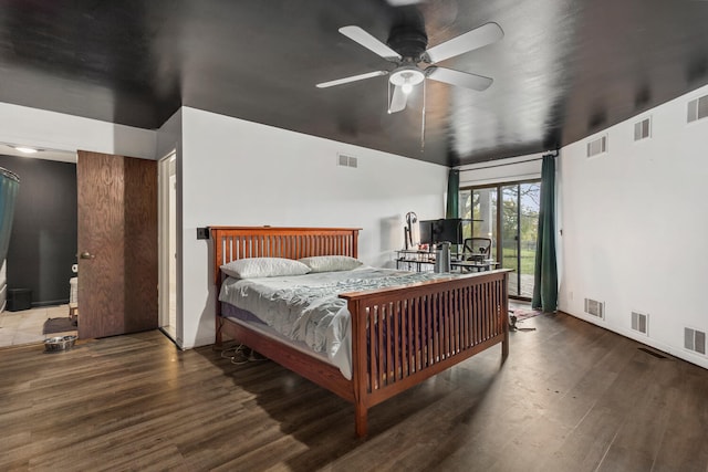 bedroom featuring access to exterior, ceiling fan, and hardwood / wood-style flooring