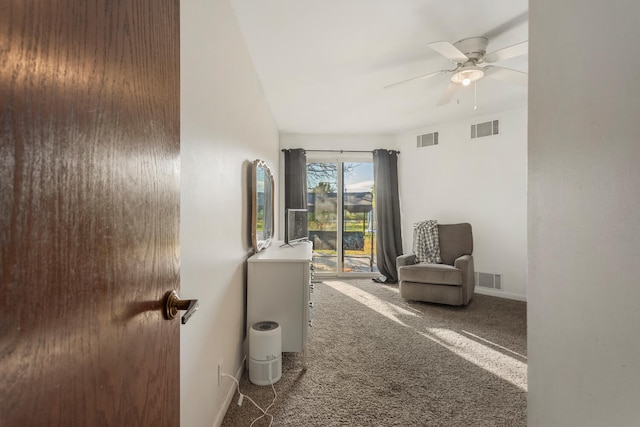 sitting room with carpet and ceiling fan