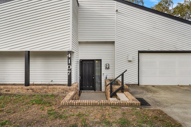 view of exterior entry featuring a garage