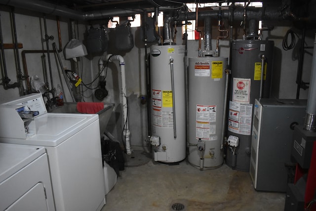 utilities with gas water heater and washer and dryer