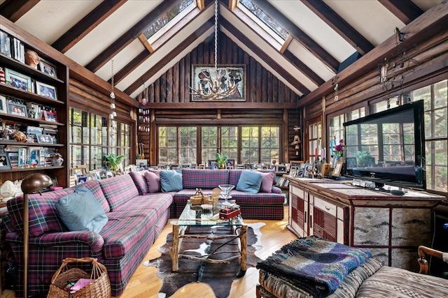 interior space featuring vaulted ceiling with skylight