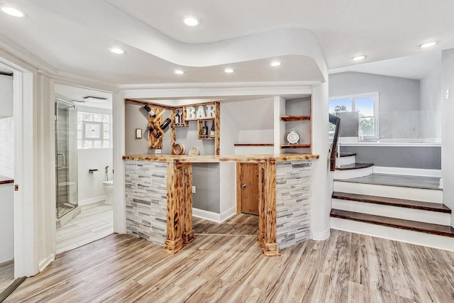 bar featuring hardwood / wood-style flooring