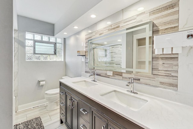 bathroom with wood-type flooring, backsplash, a shower with shower door, toilet, and vanity