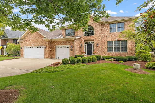 view of front facade with a garage and a front yard